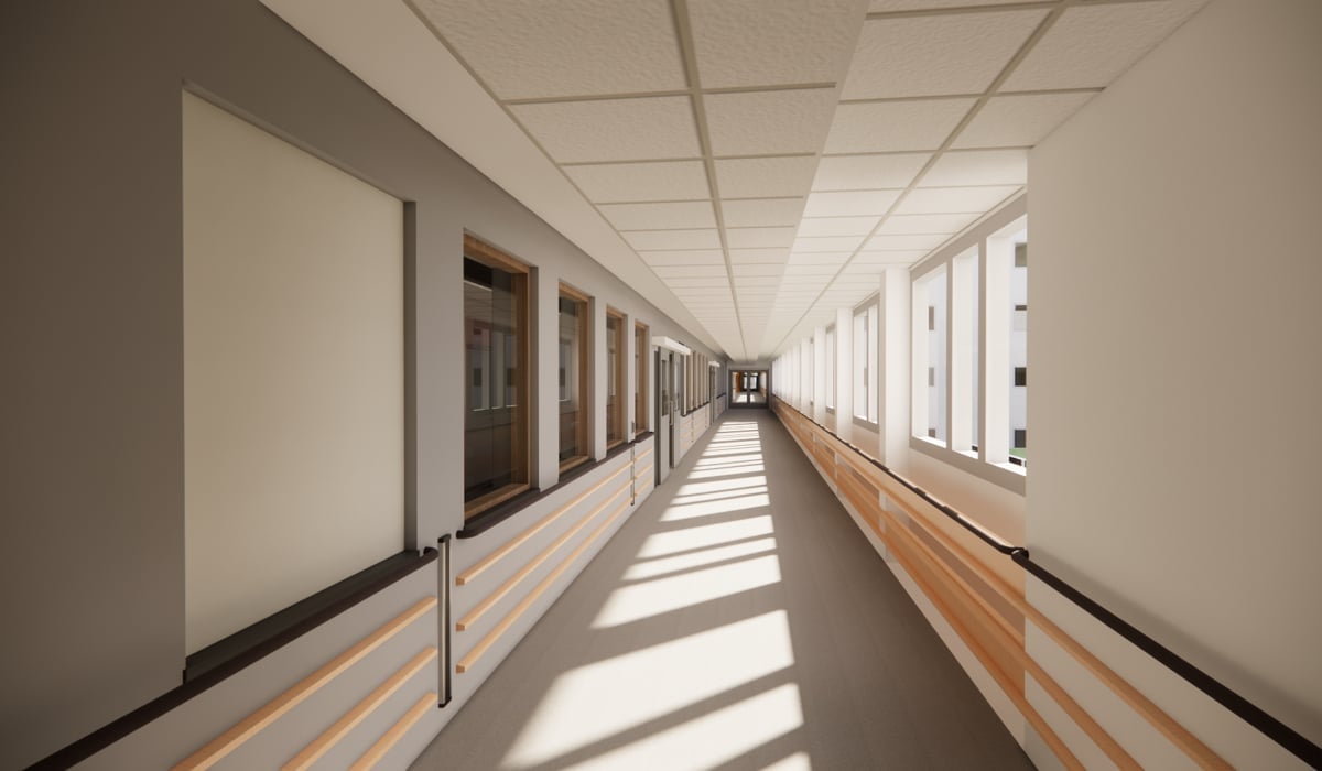 En lång korridor med fönster och en dörr.